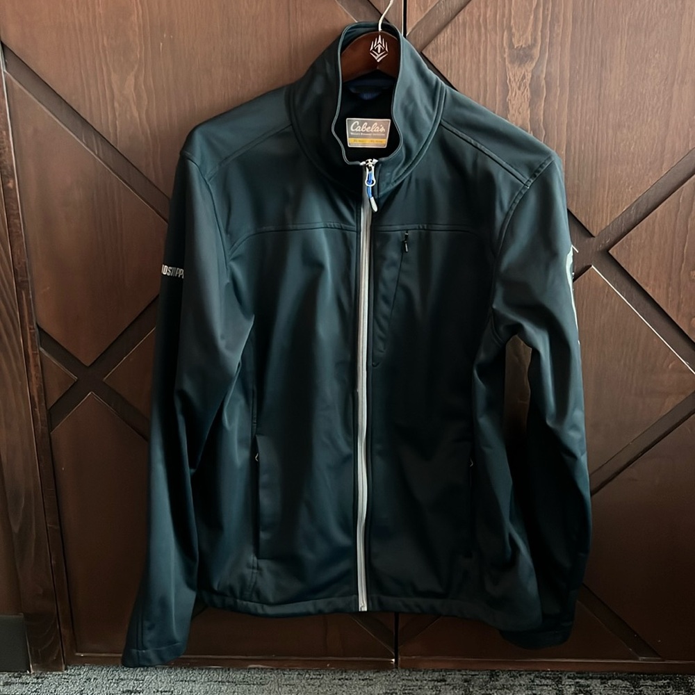 Cabela’s black Windstopper jacket with several zippered pockets.